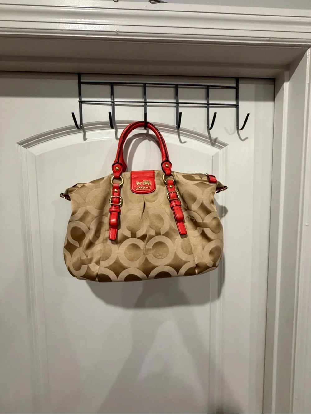 Coach Beige Signature Canvas Satchel with orange Trim and Handles. No strap